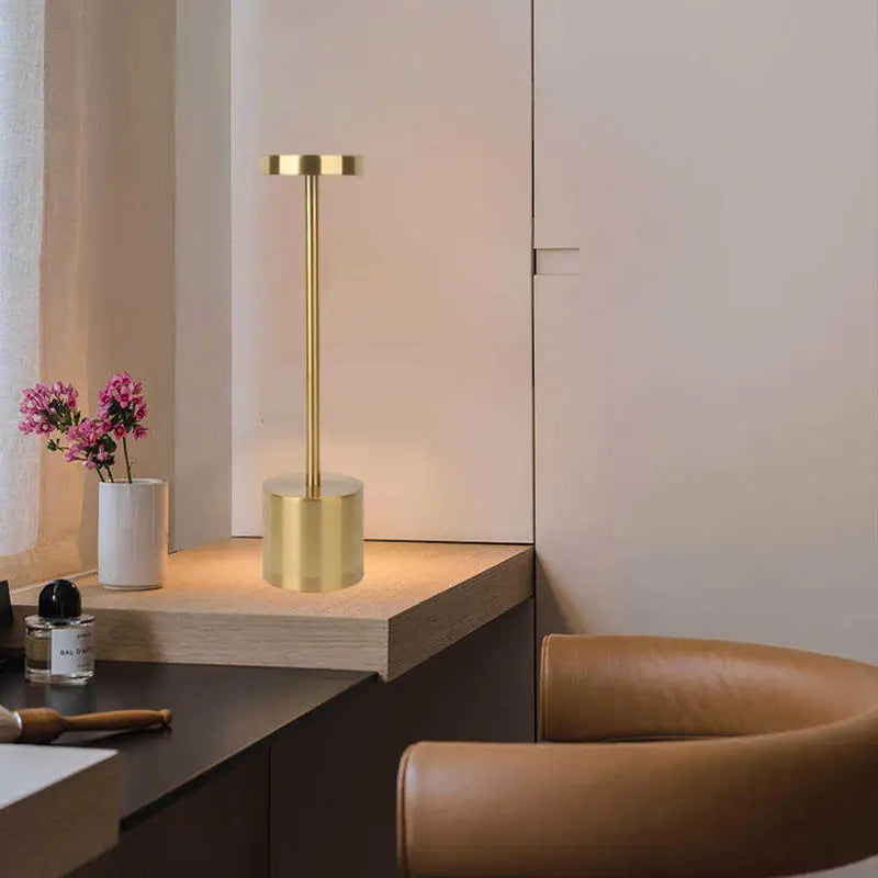 Gold-colored cylindrical lamp.