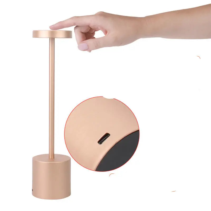 Gold touch-activated table lamp.