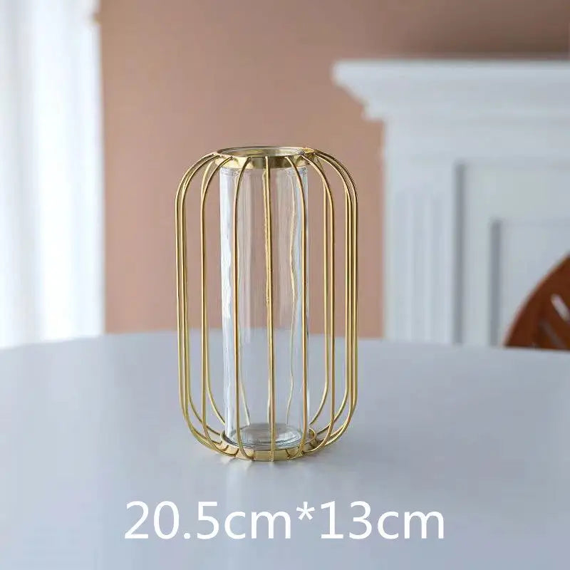 Gold metal cage vase with glass insert.