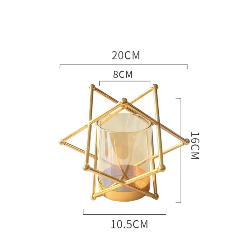 Gold geometric candle holder with glass insert.