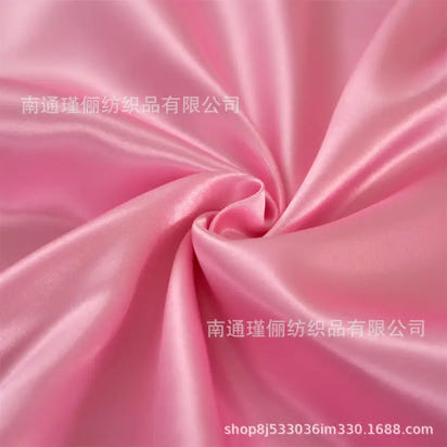 Swirled pink satin fabric.
