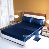 Navy blue satin bed sheet set.