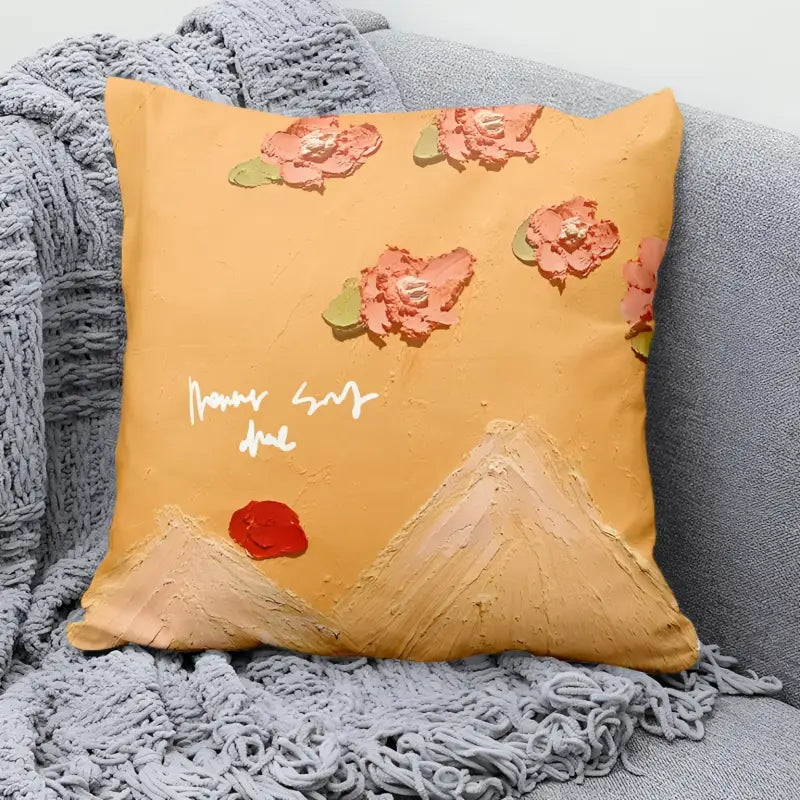 Textured floral and mountain design pillow.