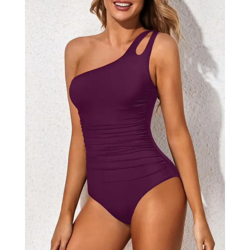 One-shoulder purple swimsuit.