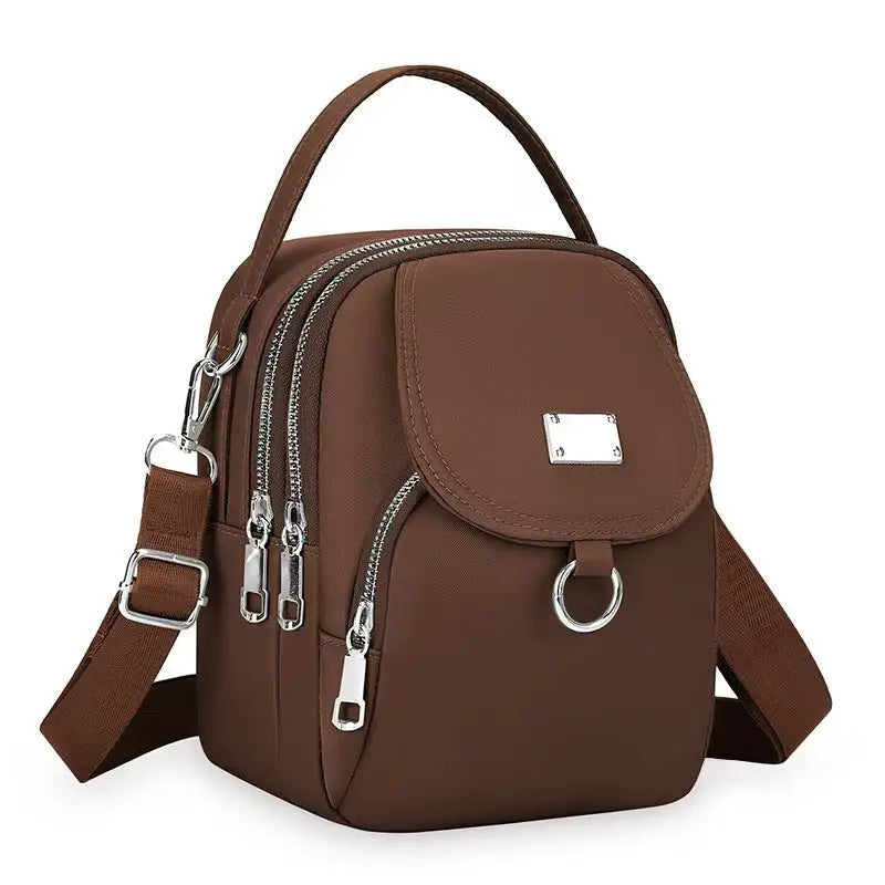 Brown Oxford Cloth Handbag with multiple pockets and crossbody style for versatile use