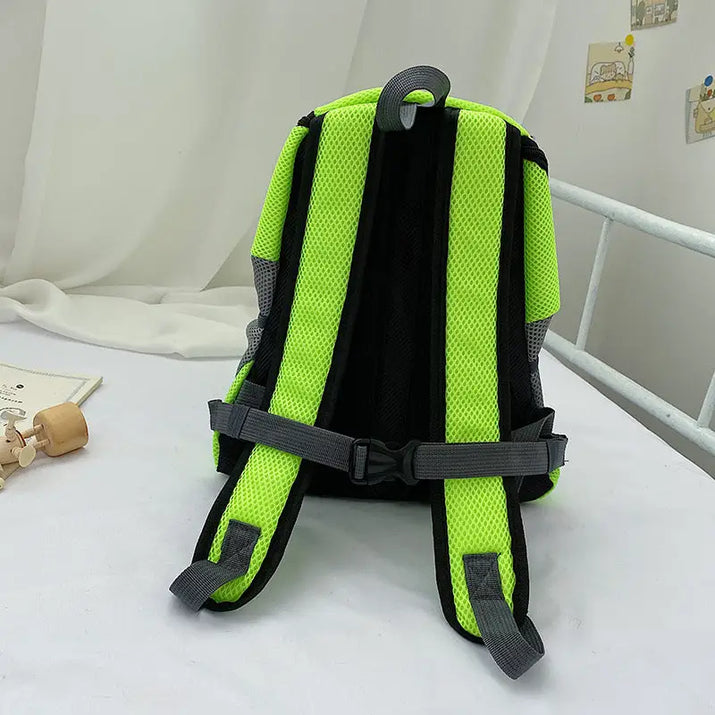 Green and black pet carrier backpack with gray straps, perfect for traveling with pets
