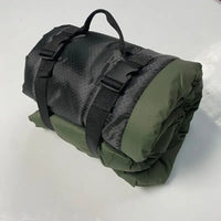 Rolled-up pet outdoor portable waterproof mat with straps for outdoor adventures