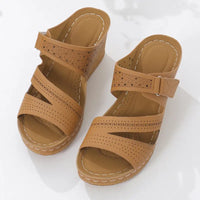 Brown perforated wedge platform round toe sandals showing stylish round toe toe sandals