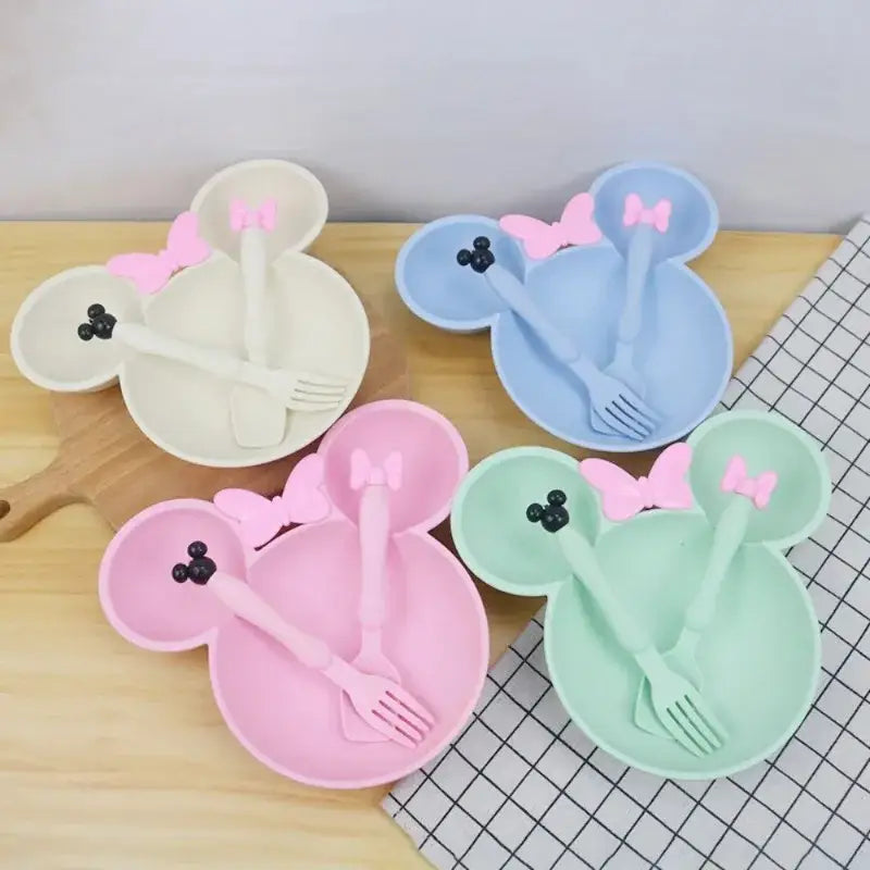 Colorful Minnie Mouse-shaped dishware sets.