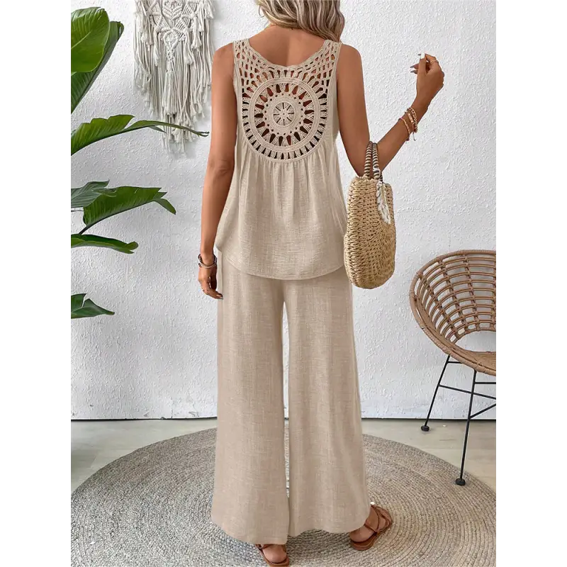 Beige linen pantsuit with crochet back.