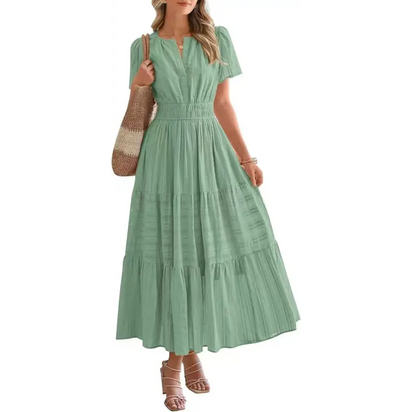 Woman in a light green maxi dress.