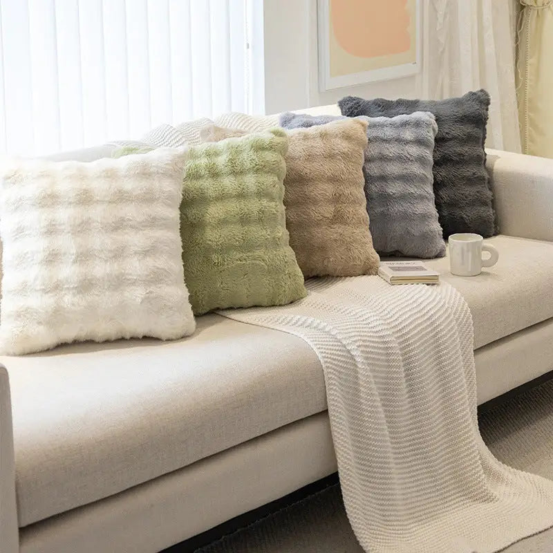 Assorted plush throw cushions for cozy decor and comfortable plush throw experience