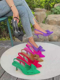 Bow Pointed Toe Pumps with a Playful Twist