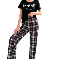 Black pajama set with plaid pants.