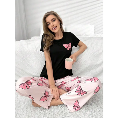 Woman in bow-themed pajamas.