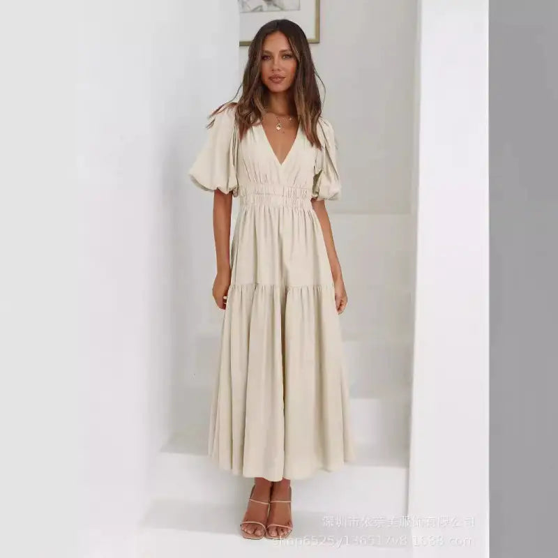 Beige tiered maxi dress.