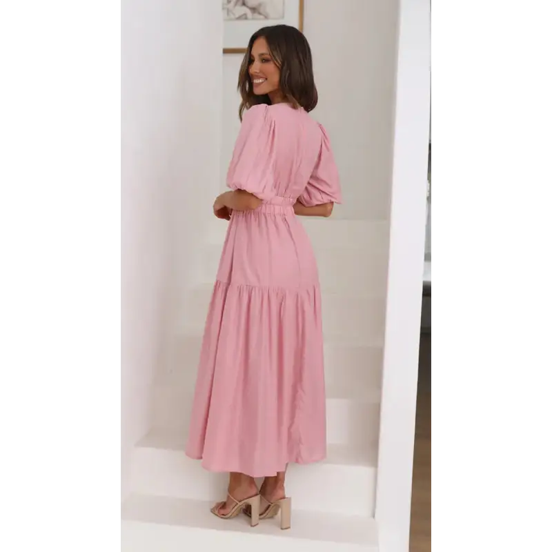 Woman in a pink midi dress.