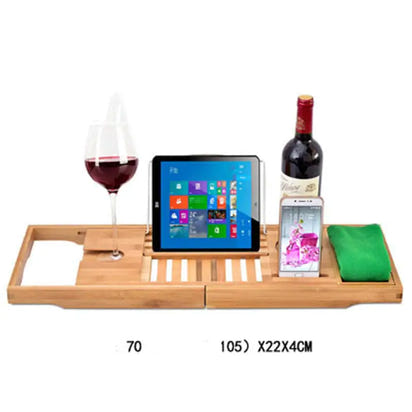 Bamboo bathtub caddy with wine, tablet, phone, and towel.