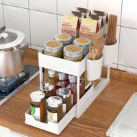 White two-tiered kitchen organizer with pull-out storage shelves for efficient storage