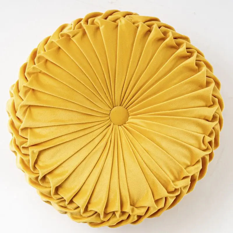 Round pleated golden-yellow Pumpkin Pillow Wheel Cushion with playful pumpkin pillow design