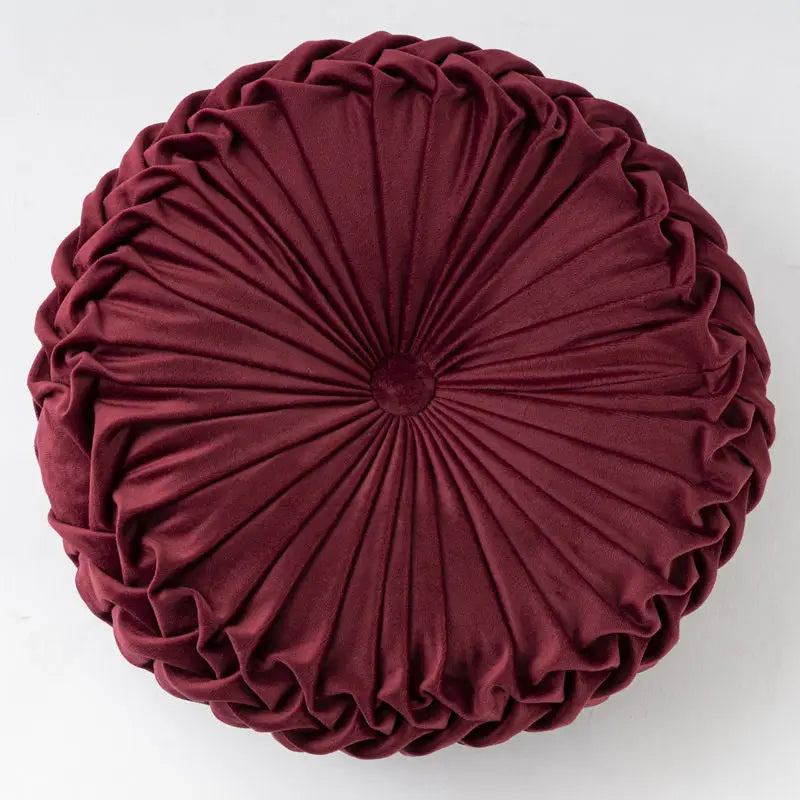 Round burgundy velvet pillow in playful pumpkin shape, perfect for Pumpkin Pillow Wheel Cushion