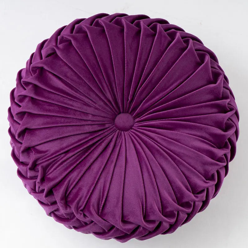 Round purple pleated velvet pillow showcasing a playful pumpkin pillow with a unique pumpkin shape