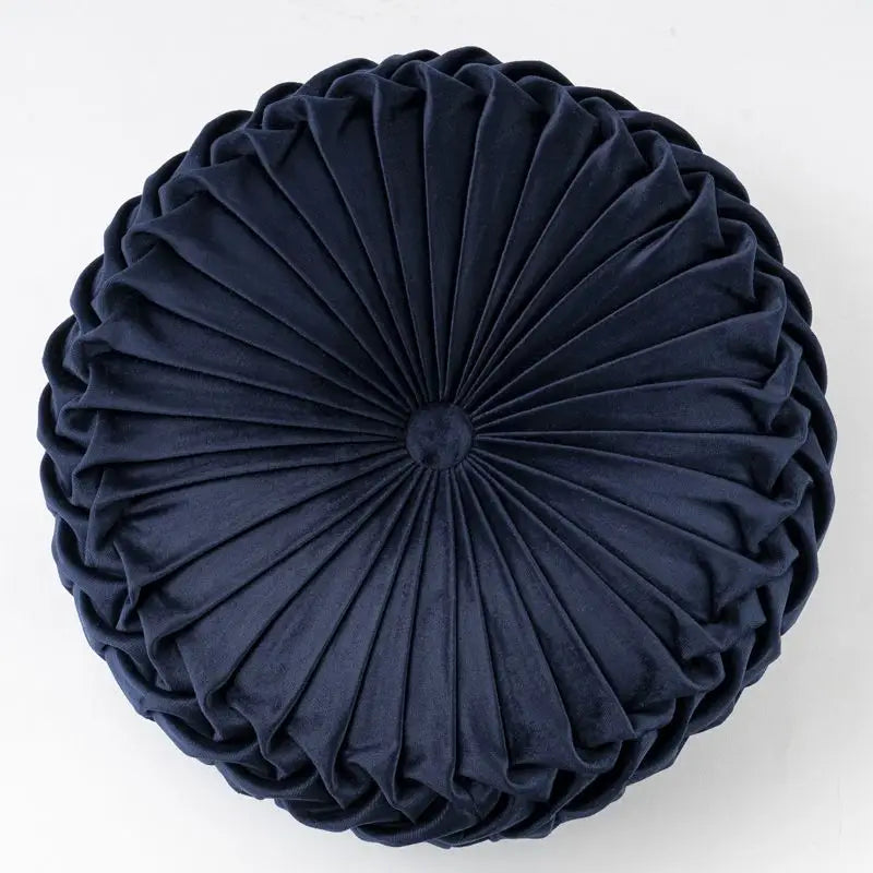 Round navy blue velvet pillow with pleated design, perfect as a playful pumpkin pillow