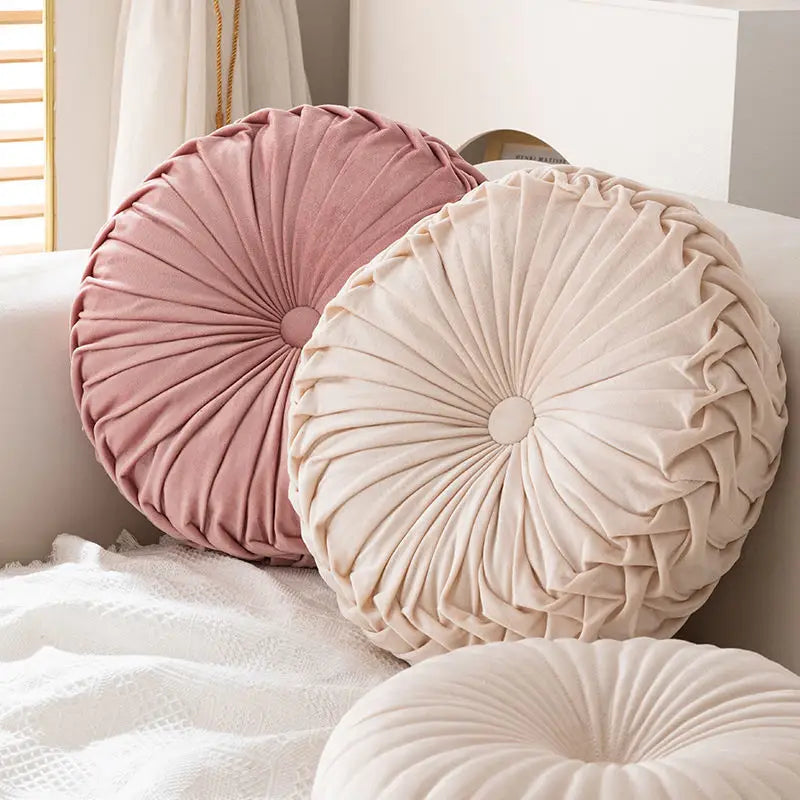 Round pleated velvet cushions in a playful pumpkin pillow with a unique pumpkin shape