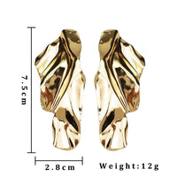 Gold-colored abstract earrings showcasing retro charm, perfect statement metal long drop earrings