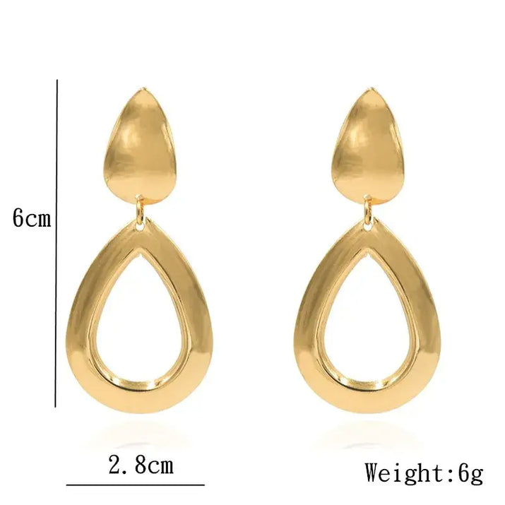 Gold teardrop earrings showcasing retro charm as statement metal long drop earrings