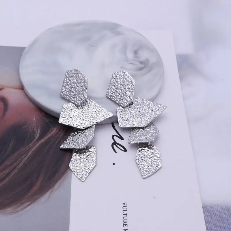 Textured silver geometric long drop earrings with retro charm, perfect for statement metal long accessories