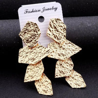 Gold geometric dangle earrings showcasing retro charm in statement metal long drop earrings