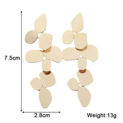 Gold-toned geometric dangle earrings showcase retro charm in statement metal long drop earrings