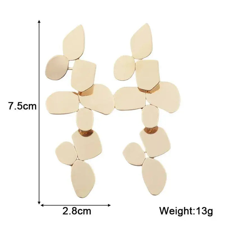 Gold-toned geometric dangle earrings showcase retro charm in statement metal long drop earrings