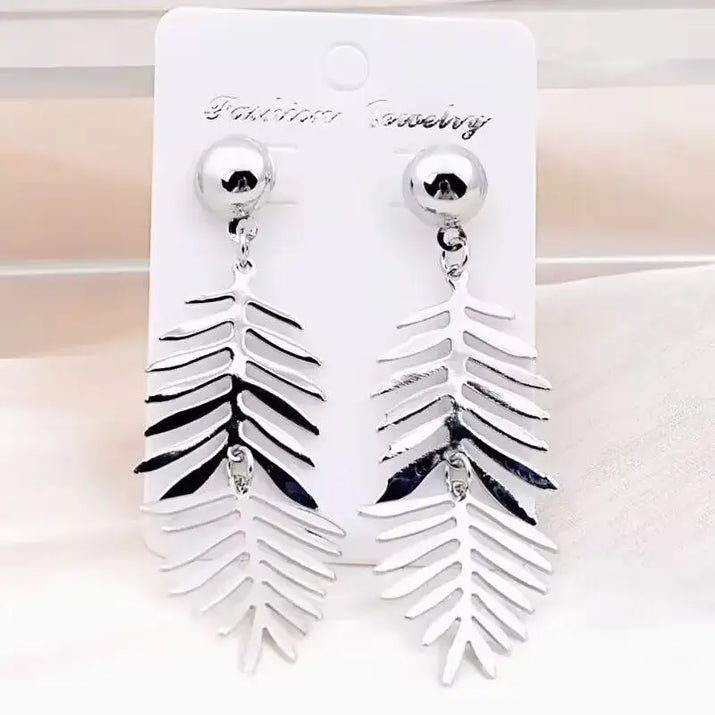 Silver leaf-shaped long drop earrings with retro charm, perfect for statement metal long jewelry