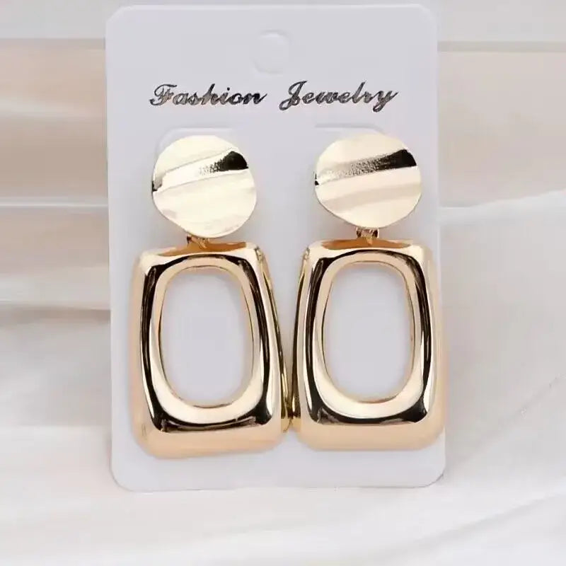 Gold-colored geometric long drop earrings with retro charm, statement metal long design