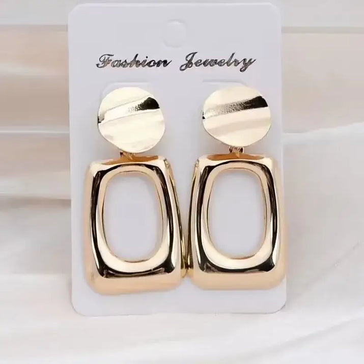 Gold-colored geometric long drop earrings with retro charm, statement metal long design