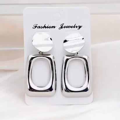 Silver geometric earrings showcasing retro charm as statement metal long drop earrings