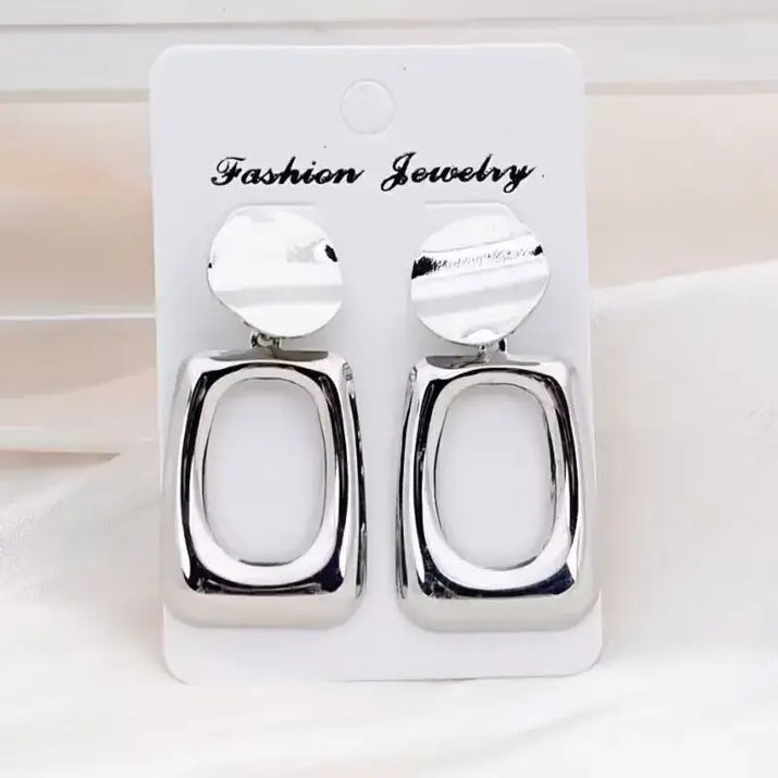 Silver geometric earrings showcasing retro charm as statement metal long drop earrings