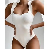 White ruffled one-piece swimsuit.
