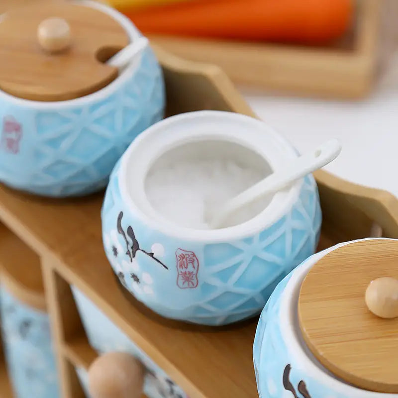 Blue ceramic spice jars on Salt Sugar Glass Seasoning Box Shelf for organized storage