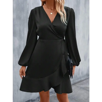 Black wrap dress with long sleeves.