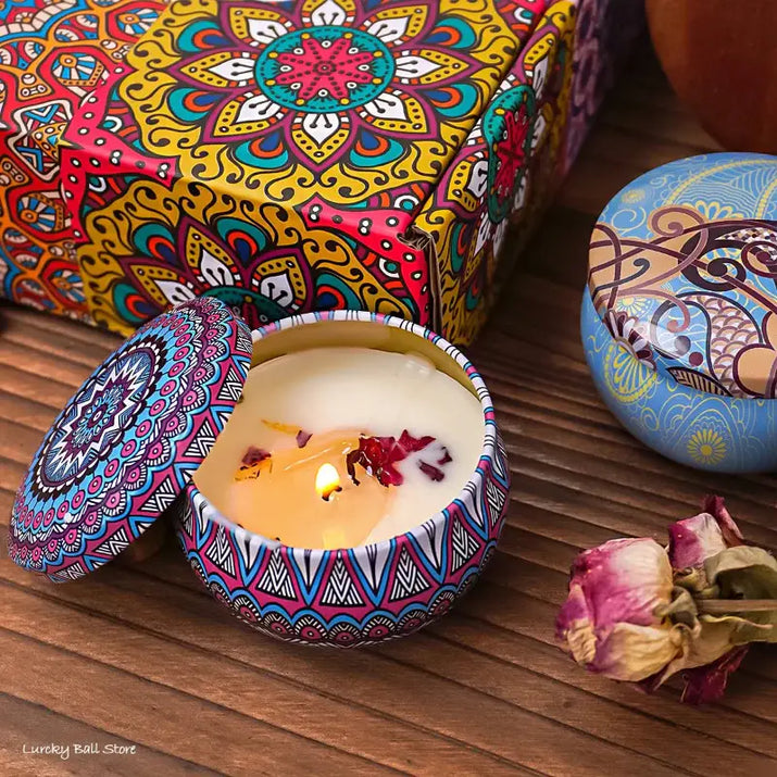 Scented candle in decorative tin.