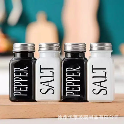 Playful set of salt and pepper shakers, including a stylish pepper shaker for your table