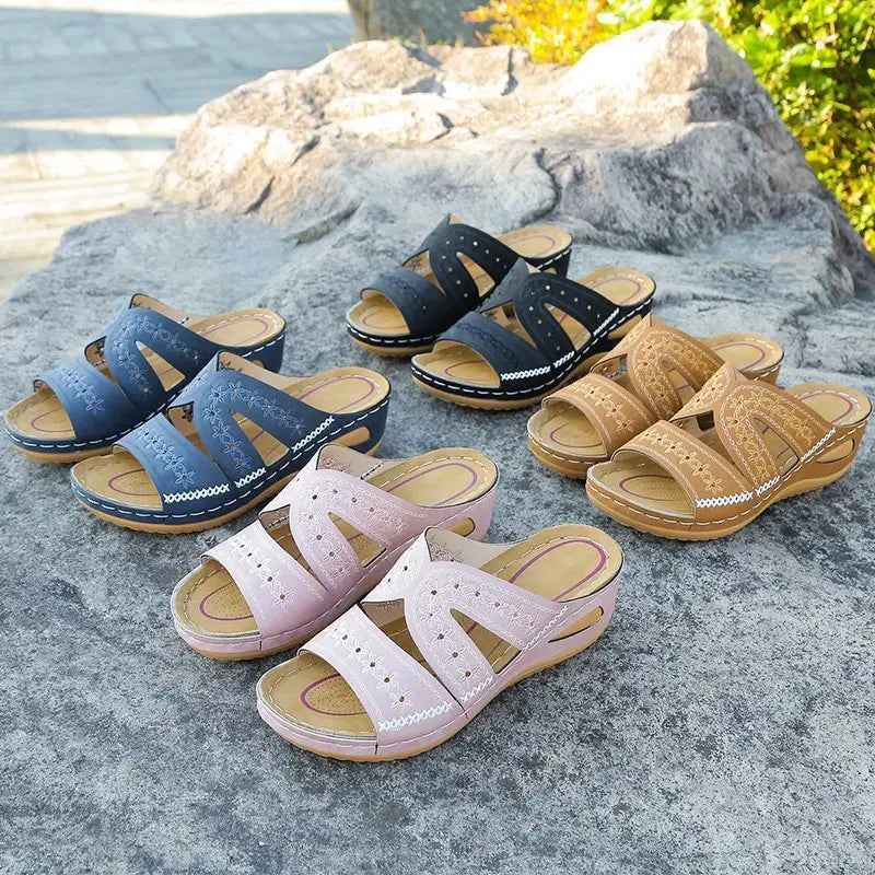 Assorted women’s comfort embroidered sandals featuring a quirky slip-on design