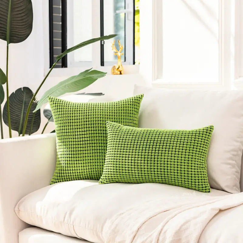Green textured throw pillows featuring the Soft Plaid Corn Kernel Square Cushion design