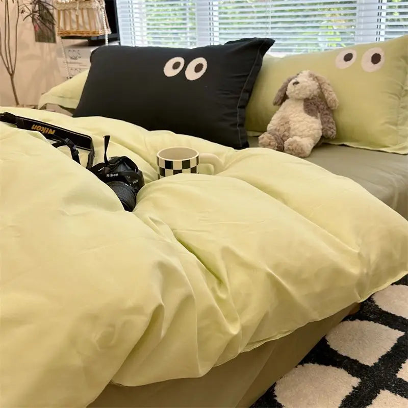 Whimsical bedding with eye-motif pillows.