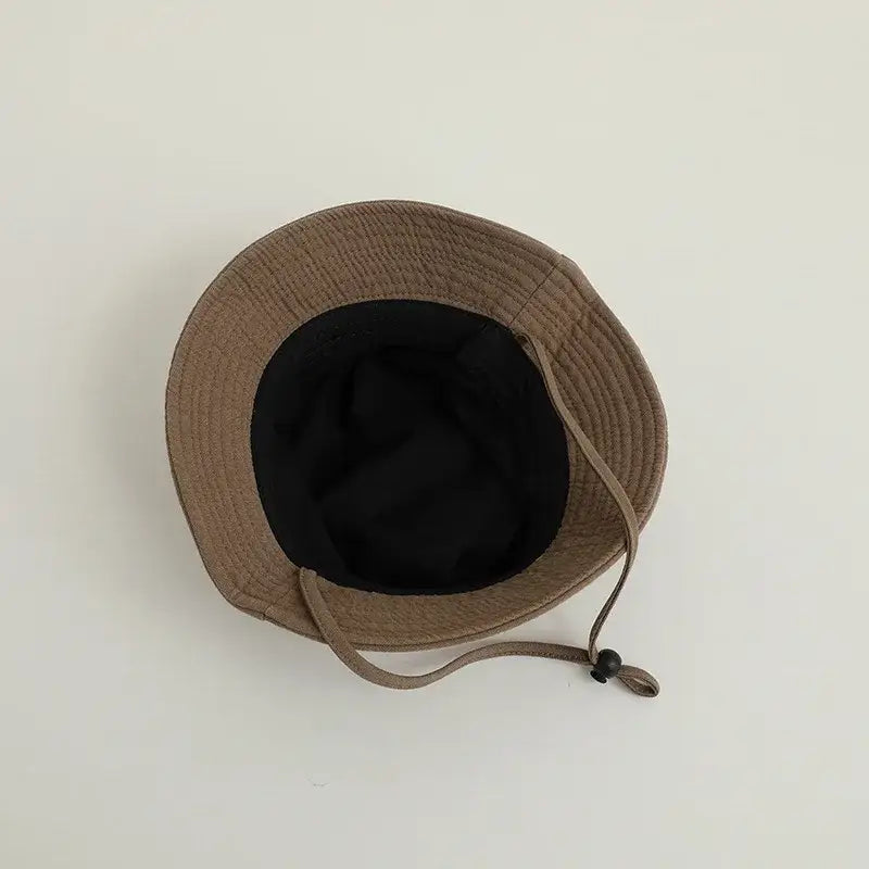 Kids bucket hat with brown color and black lining, ideal sun protection hat for summer