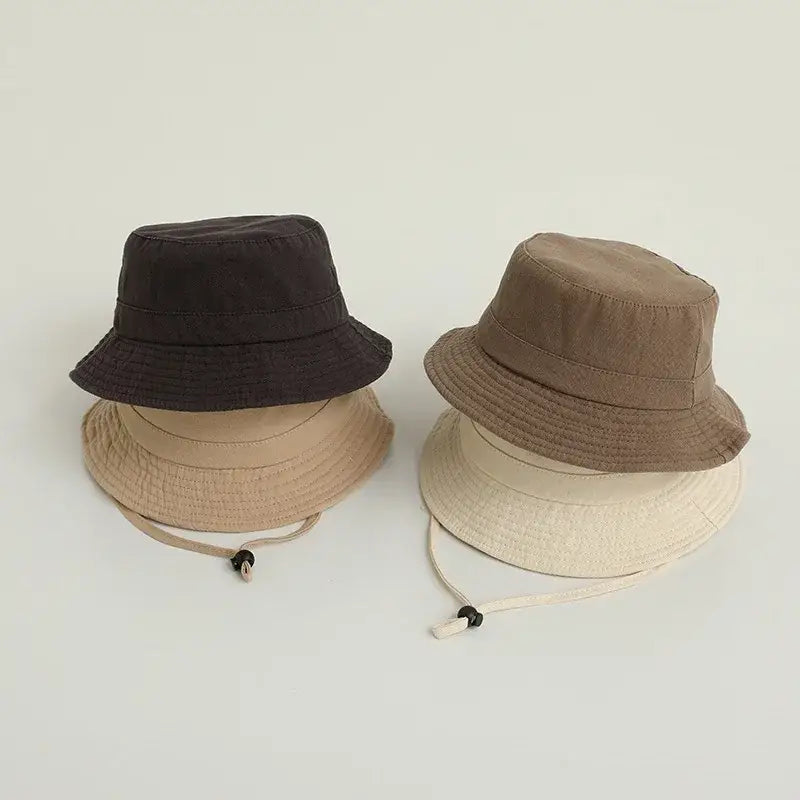 Stacked solid color kids bucket hats, the perfect sun protection hat for outdoor fun