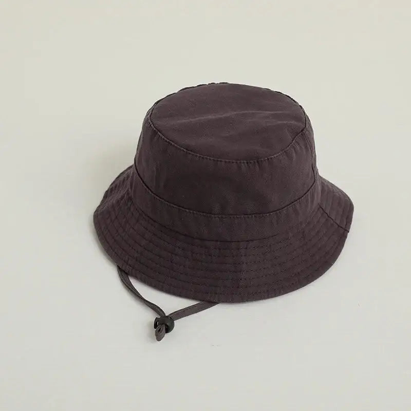 Dark brown solid color kids bucket hat with chin strap for sun protection